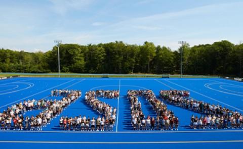 The Class of 2026 poses for a photo in an arranged pattern depicting the year "2026"
